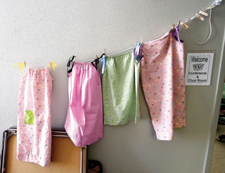 Girl Scouts make dresses for Swaziland